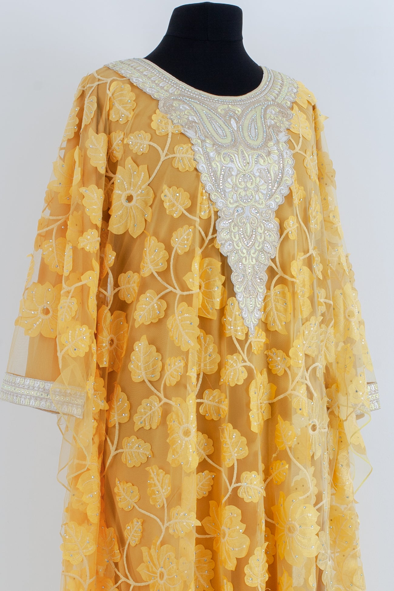 Embroidered yellow Jalabiyah.